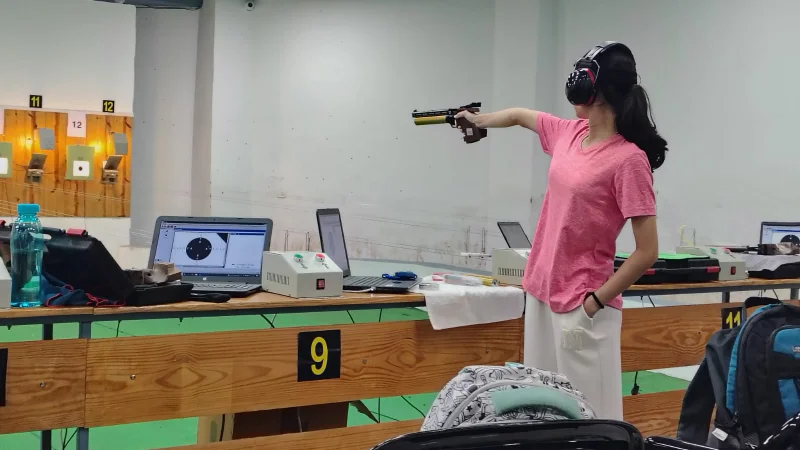 Kasturi Yogesh Malode competing in the Air Pistol Shooting event
